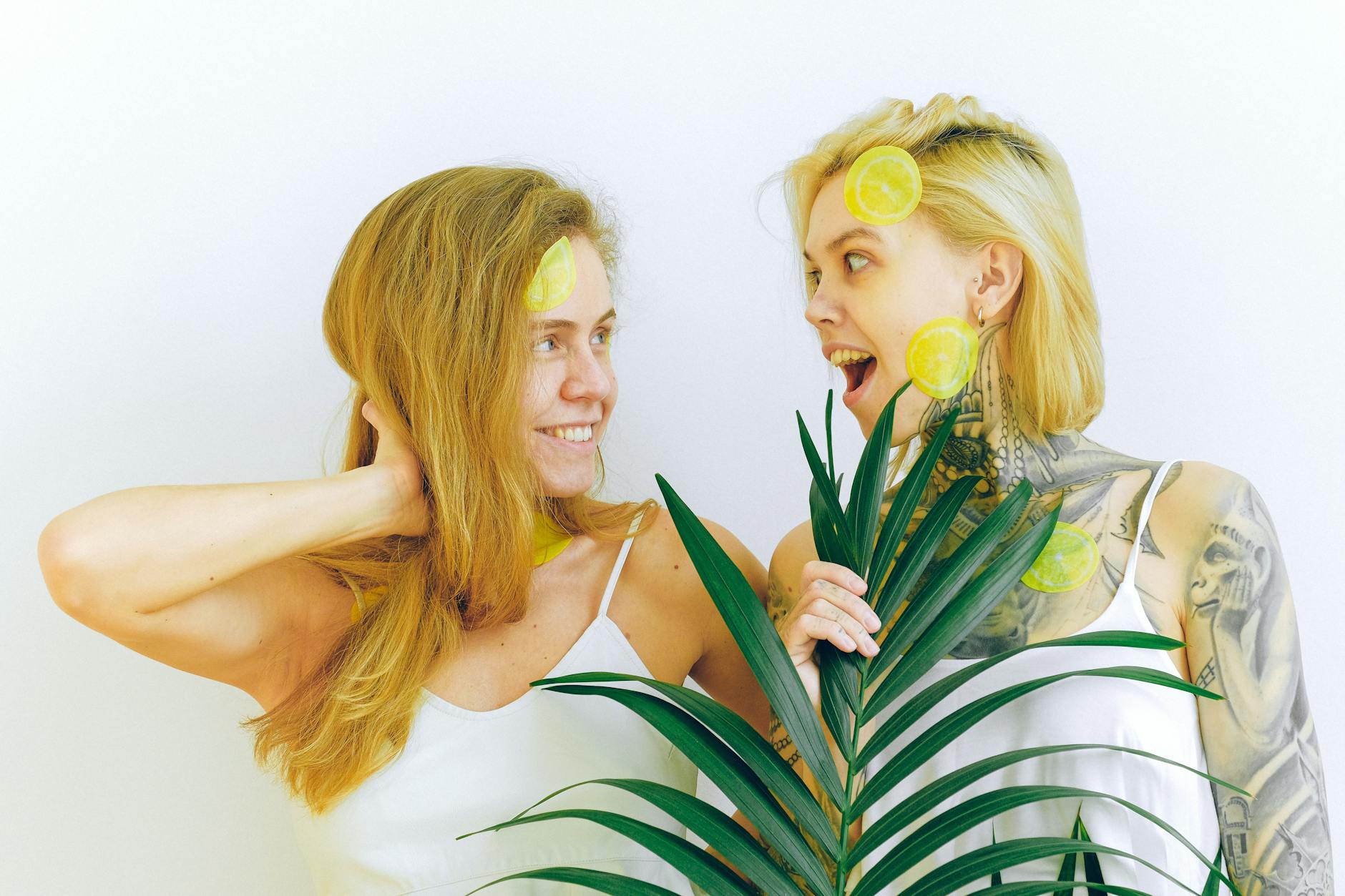 Two women expressing joy and confidence indoors