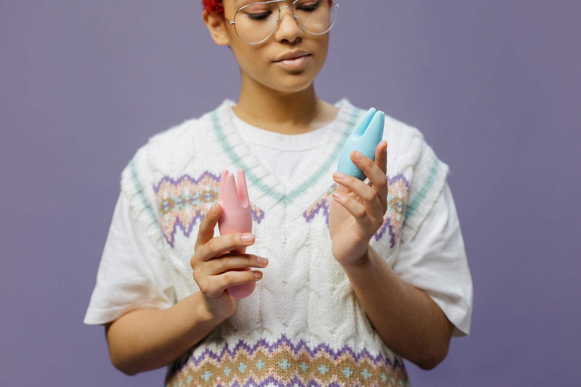 Person holding a blue silicone vibrator, considering options for restored sensation.