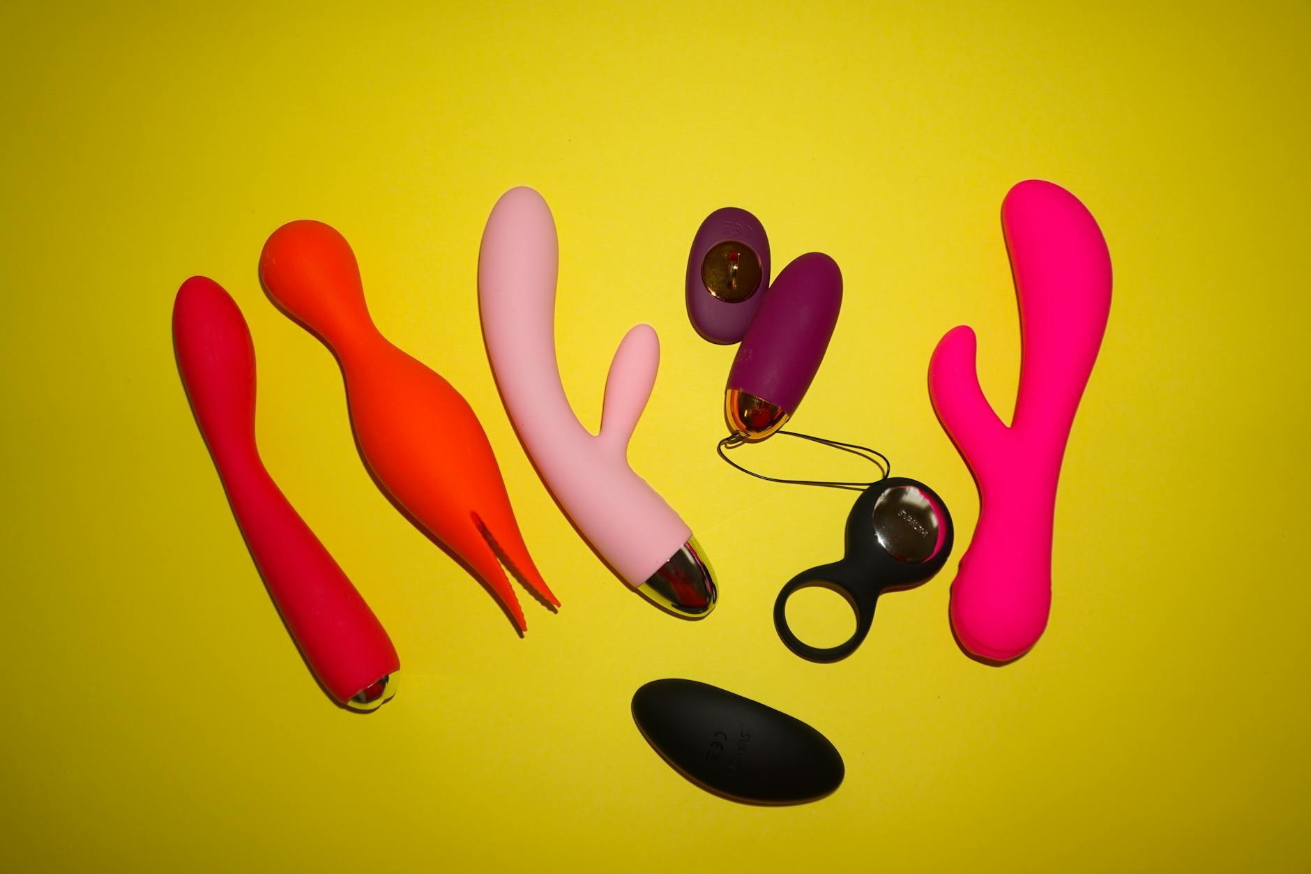 Hand holding a vibrator demonstrating modern intimate pleasure tools